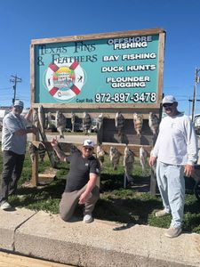 Successful fishing trip displaying redfish, black drum, and sheepshead catch in Port O'Connor TX