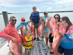 Successful red snapper fishing trip in Port O'Connor TX with multiple large catches displayed on boat