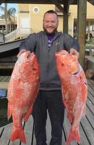 Two big fish caught during a fishing, hunting, and tours trip in TX