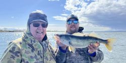Joyful catch and a glimmering walleye!