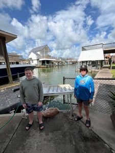 Two people fishing in TX