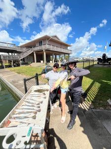 Three people enjoying fishing on Tiki Island