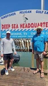 Three people fishing in the beautiful waters of Port Aransas
