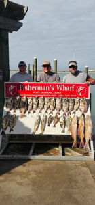 A group of 3 people fishing in Port Aransas