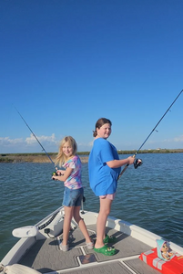 Anglers fishing on the coast of Port Aransas