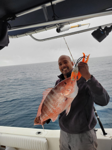 A fisherman with a 15-inch catch at Wrightsville Beach