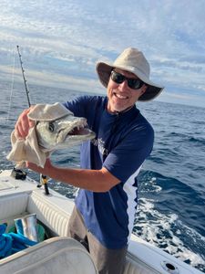 A person fishing at Wrightsville Beach