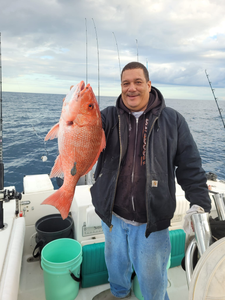Angler holding a 21-inch fish at Wrightsville Beach