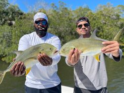 Two anglers with a great catch of two large fish in Fort Myers