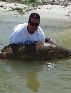 Fisherman standing in Fort Myers with a fishing rod