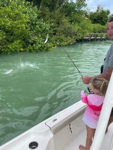Two anglers enjoying a fishing trip in FL