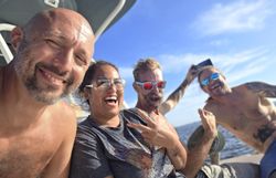 Three people enjoying a fishing trip in Fort Myers