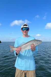 Photograph of a 21-inch redfish caught while fishing in Florida