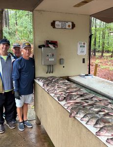 Three people fishing on the lake in GA