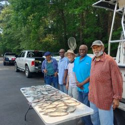 A group of 5 people enjoying fishing in GA