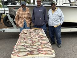 A group of 3 people fishing for crappie in Thomson
