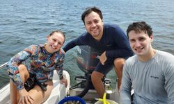Three people enjoying a fishing cruise in FL