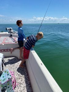Two people fishing in FL