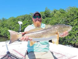 Angler holding fishing rod in FL