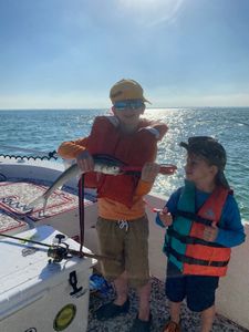 Two people enjoying a fishing holiday