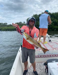 Angler enjoying a holiday fishing trip with a catch