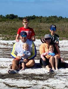 Group of six people enjoying a holiday fishing trip