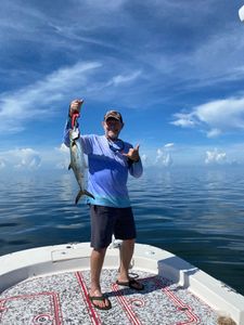Fisherman holding a Spanish Mackerel in FL