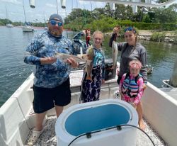 Two small fish caught on a fishing trip in Florida