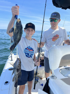 Two anglers fishing at Barnegat Light, New Jersey