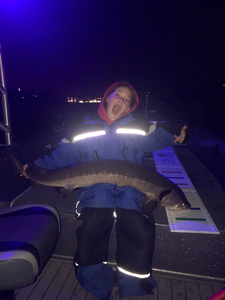 A person fishing in Minnesota water sports