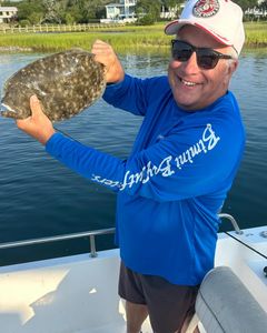 On the deck with a stunning flounder