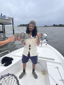 Reeling in a Black Drum on a stormy Wilmington day!