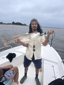 Big redfish reeled in on a partly cloudy day!