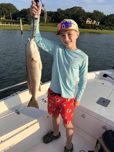 Hooked into a feisty redfish on a perfect day in Wilmington!