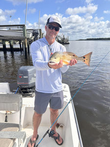 A thrilling day hauling in a prized Redfish on the open waters of Wilmington!