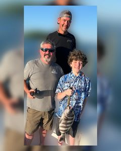 A fisherman holds up a sheepshead fish caught in Wilmington