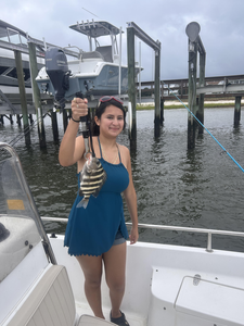 Reeling in a feisty Sheepshead on a partly cloudy day!