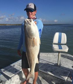 A person fishing with a rod in Texas