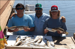 Two anglers fishing in Florida with two fish