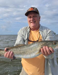 Angler fishing with rod and reel at Oak Hill location