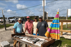 Four people fishing outdoors in Oak Hill