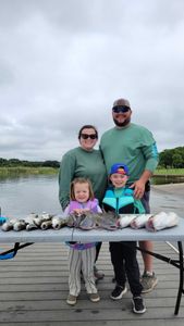 Group of 4 people fishing at Cedar Shores