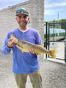 Angler holding a 18-inch fish in the state of OH