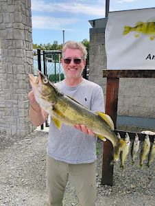 Angler holding a 20-inch fish in Vermilion