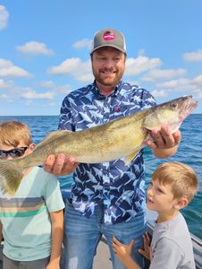 Angler holding a pike-perch fish in Ohio