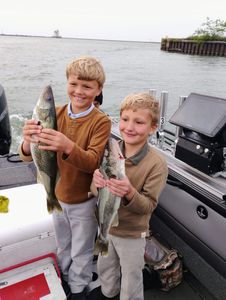 Two anglers fishing in OH with 2 fish