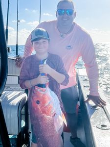 Two anglers fishing in the waters of Gulf Shores