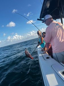 A person fishing in the waters of Gulf Shores