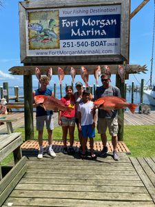 5 people fishing in Gulf Shores