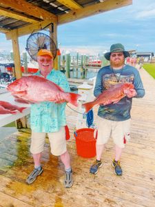 Two red snapper fish caught during fishing trip in Gulf Shores AL